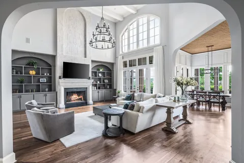 a view of a dining room with furniture and chandelier