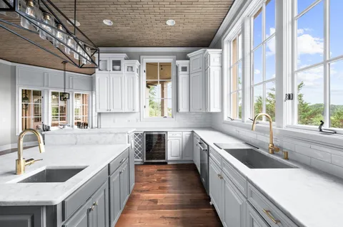 a spacious bathroom with a double vanity sink and a mirror