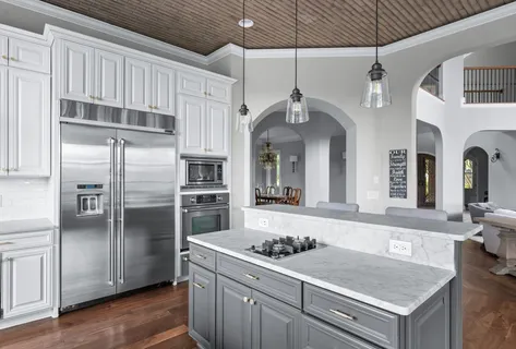a bath tub sitting in a bathroom next to a window