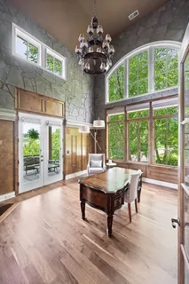 a bathroom with a granite countertop sink a mirror and a vanity