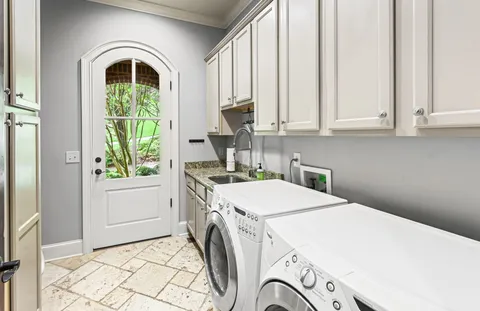 a view of a house with a wooden deck