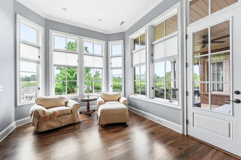 a view of a patio with a table chairs and a backyard