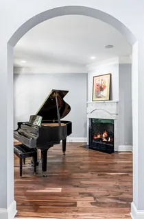 a kitchen with lots of counter furniture appliances and a dining table