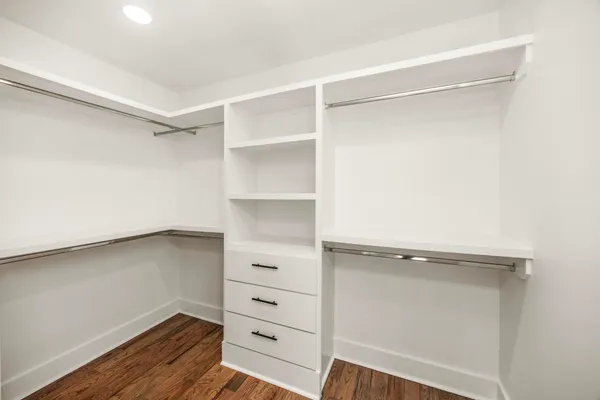a view of an empty walk in closet