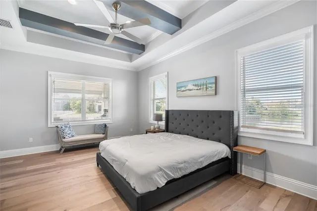 a bedroom with a large bed and a window