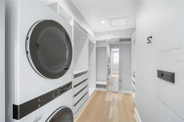 a view of a bedroom with washer and dryer