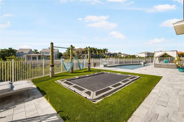 a view of a swimming pool with a lounge chair