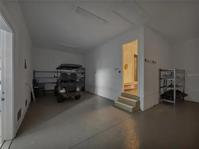 a living room with furniture and a gate