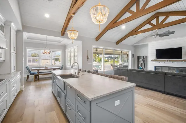 a kitchen with sink stove and cabinets