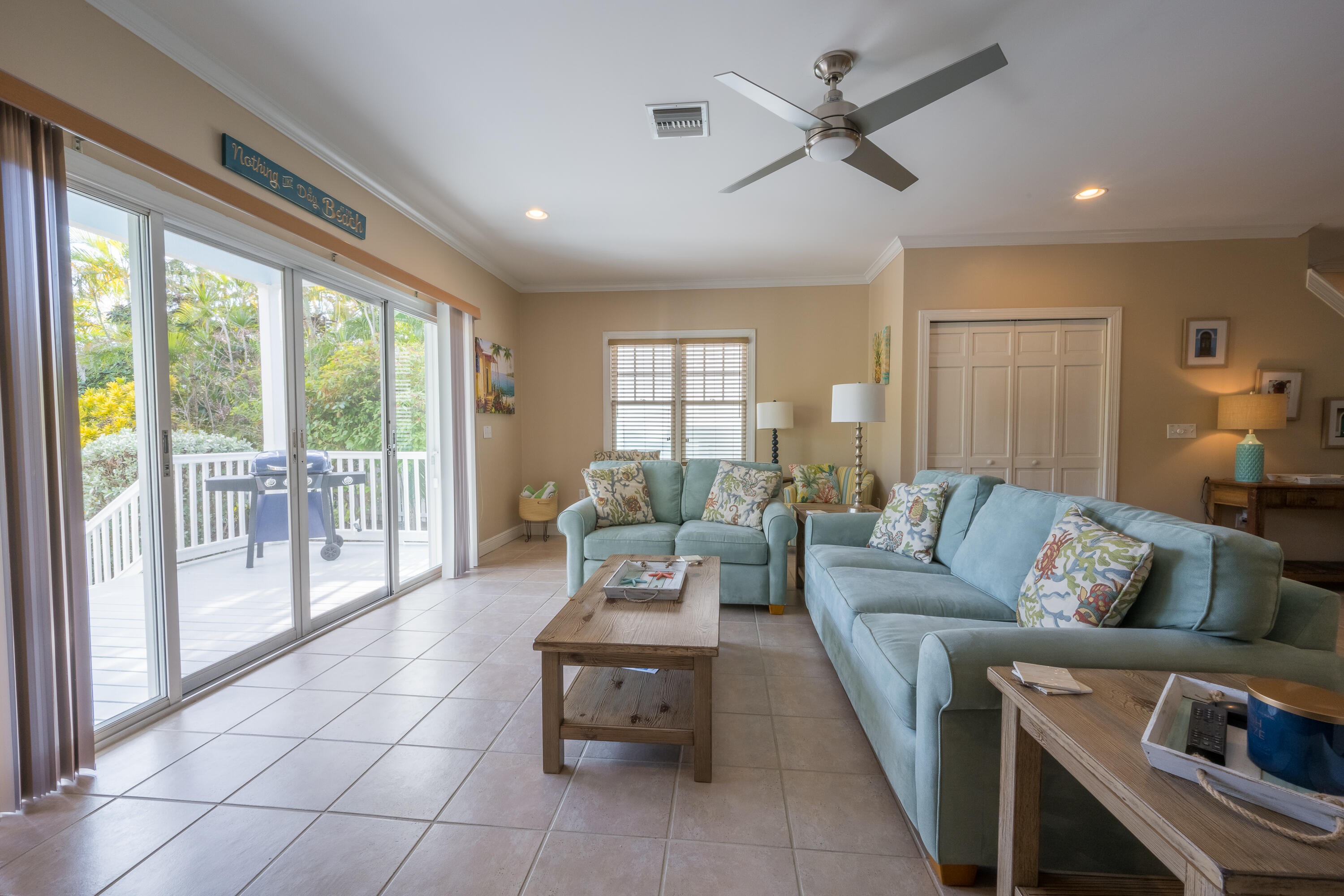 243 Golf Club Drive Key West, FL 33040 - Photo 12 of 54 a living room with furniture and a large window