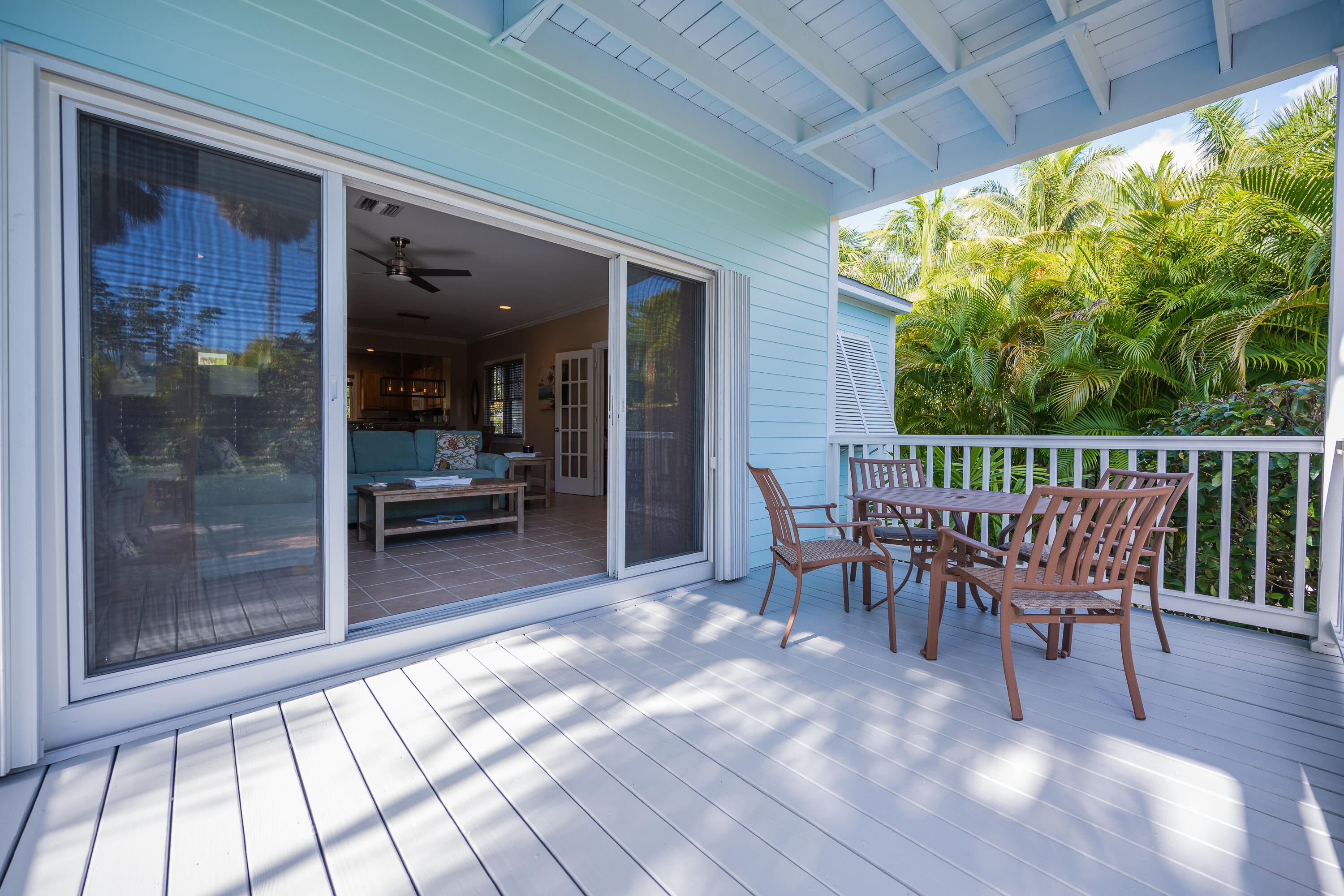 243 Golf Club Drive Key West, FL 33040 - Photo 15 of 54 a view of a patio with a table and chairs
