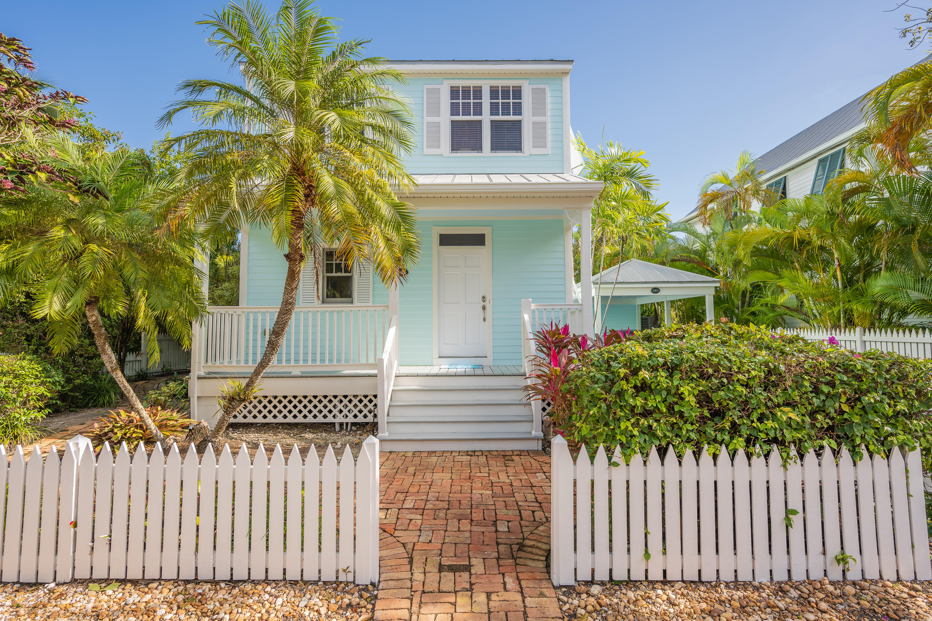 243 Golf Club Drive Key West, FL 33040 - Photo 2 of 54 a front view of a house having yard