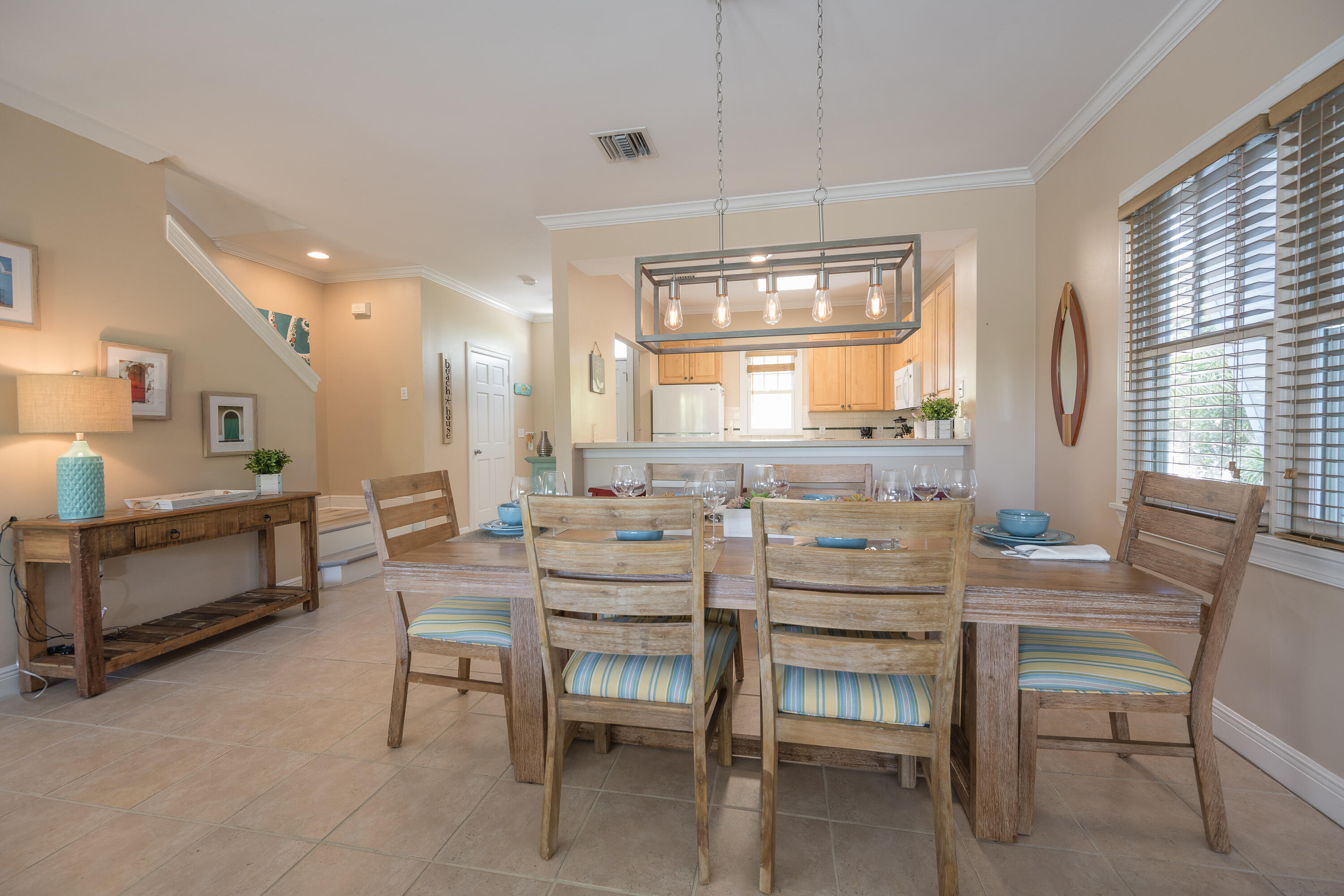 243 Golf Club Drive Key West, FL 33040 - Photo 21 of 54 a dining room with furniture a chandelier and window
