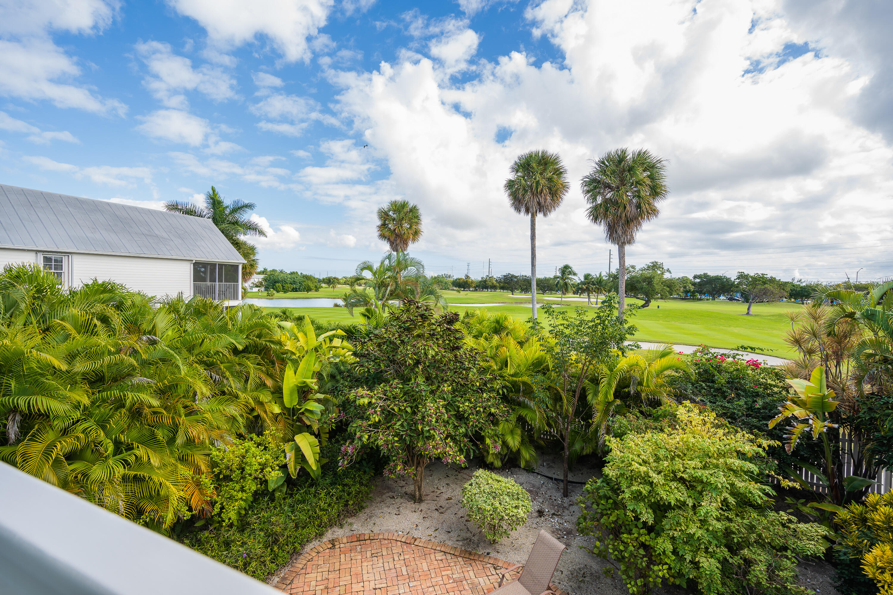 243 Golf Club Drive Key West, FL 33040 - Photo 28 of 54 a view of a garden with an outdoor seating