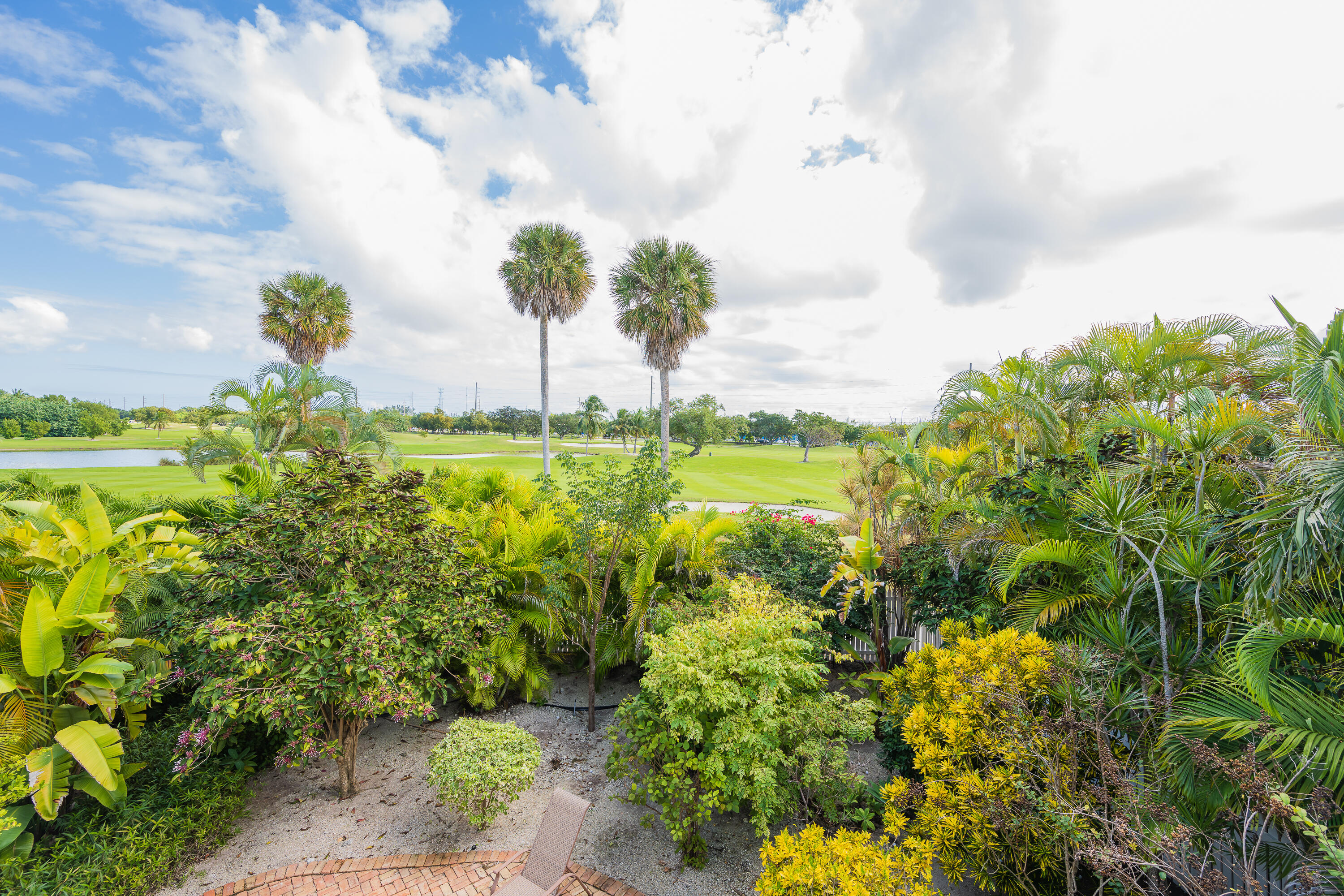 243 Golf Club Drive Key West, FL 33040 - Photo 29 of 54 a view of a large yard with plants and large trees