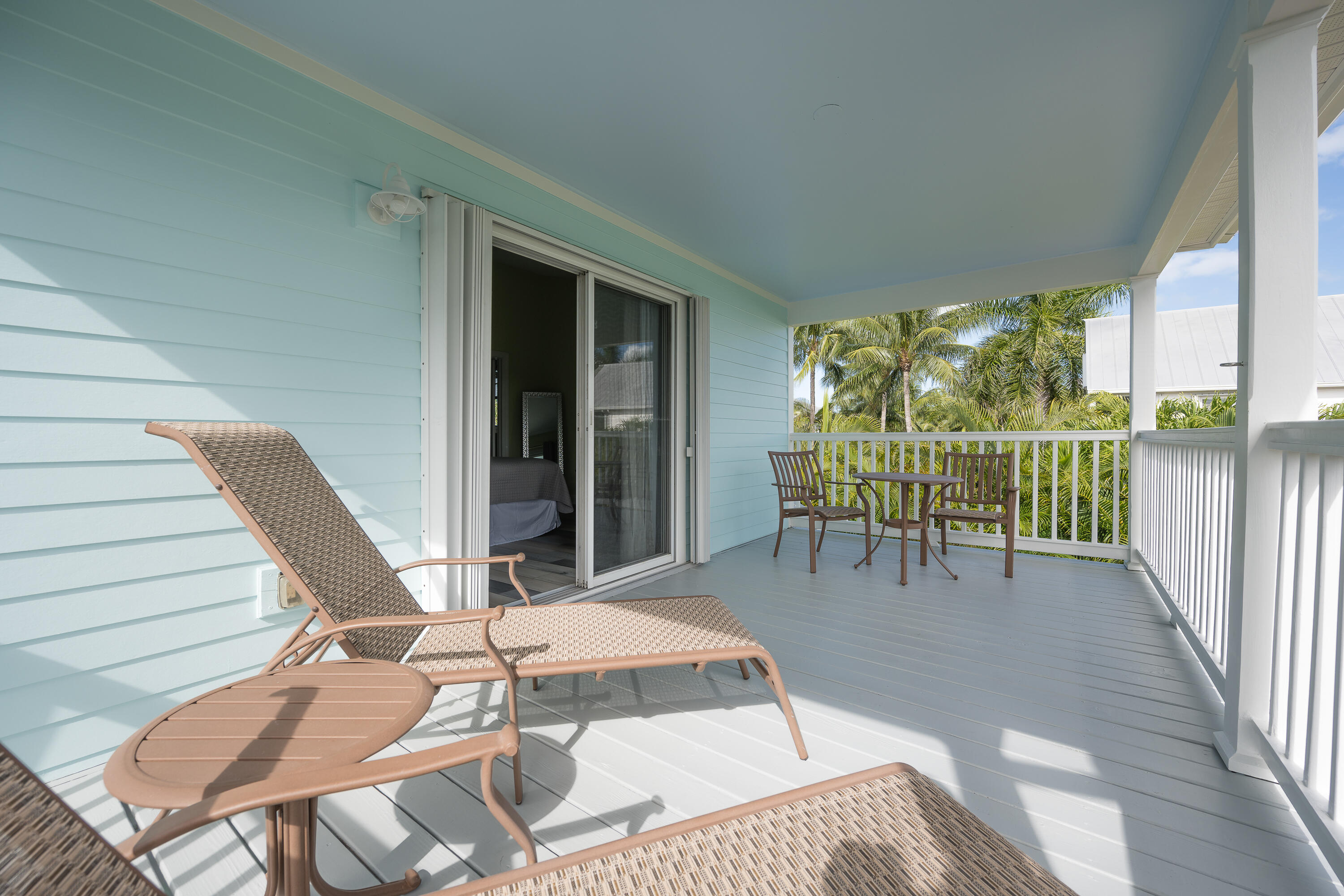 243 Golf Club Drive Key West, FL 33040 - Photo 30 of 54 a balcony with table and chairs