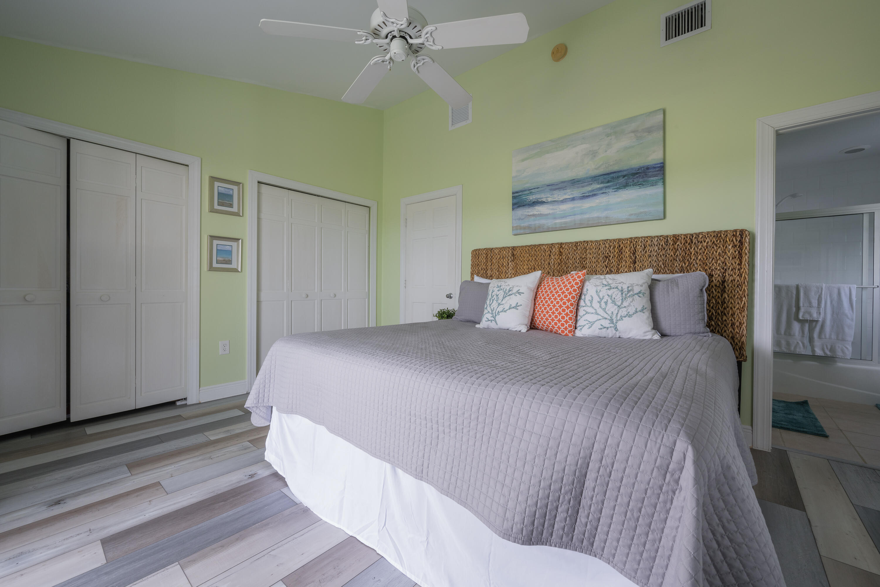 243 Golf Club Drive Key West, FL 33040 - Photo 33 of 54 a bedroom with a bed and wooden floor