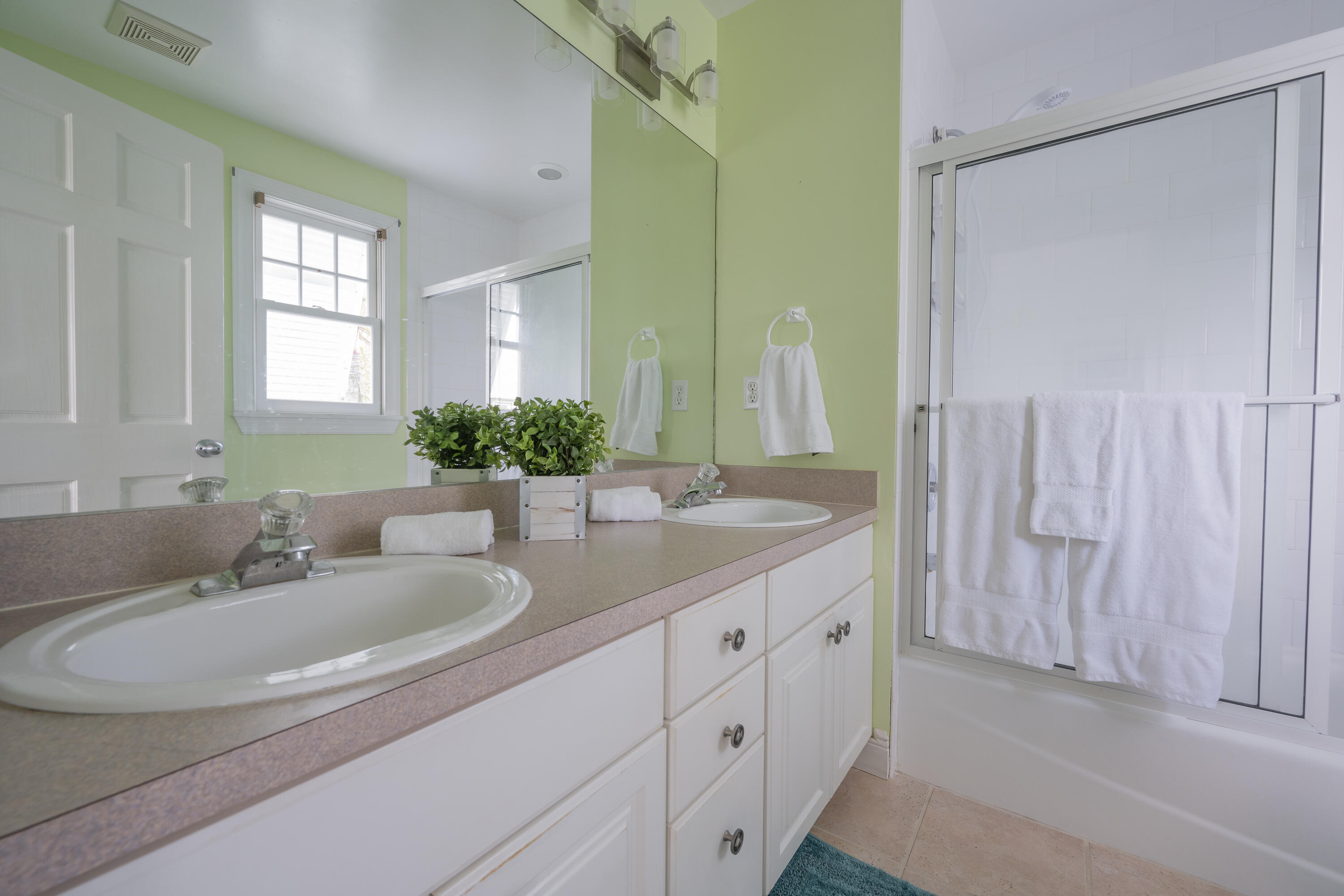 243 Golf Club Drive Key West, FL 33040 - Photo 34 of 54 a bathroom with a double vanity sink and a mirror