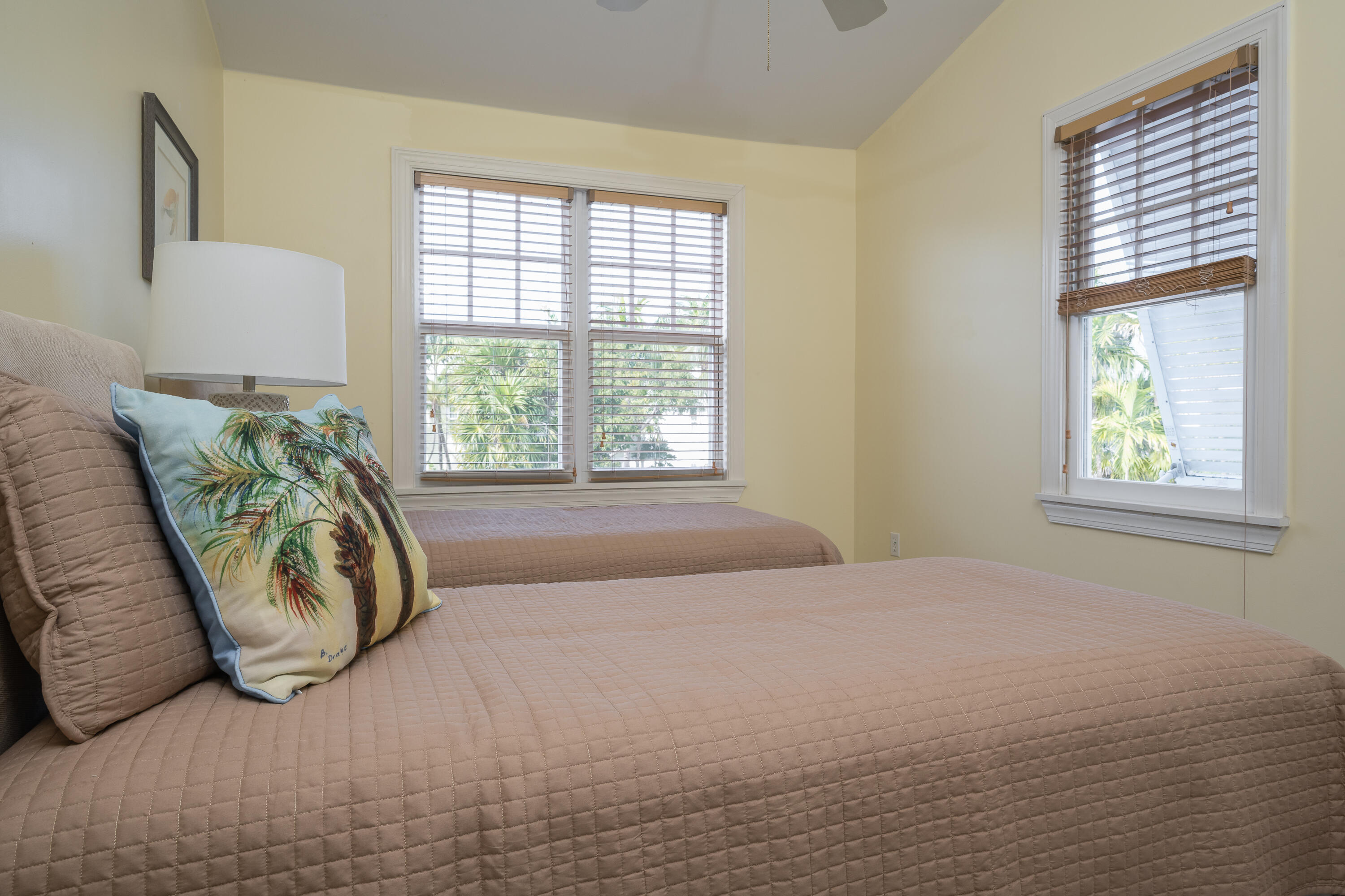 243 Golf Club Drive Key West, FL 33040 - Photo 39 of 54 a bed sitting in a bedroom next to a window
