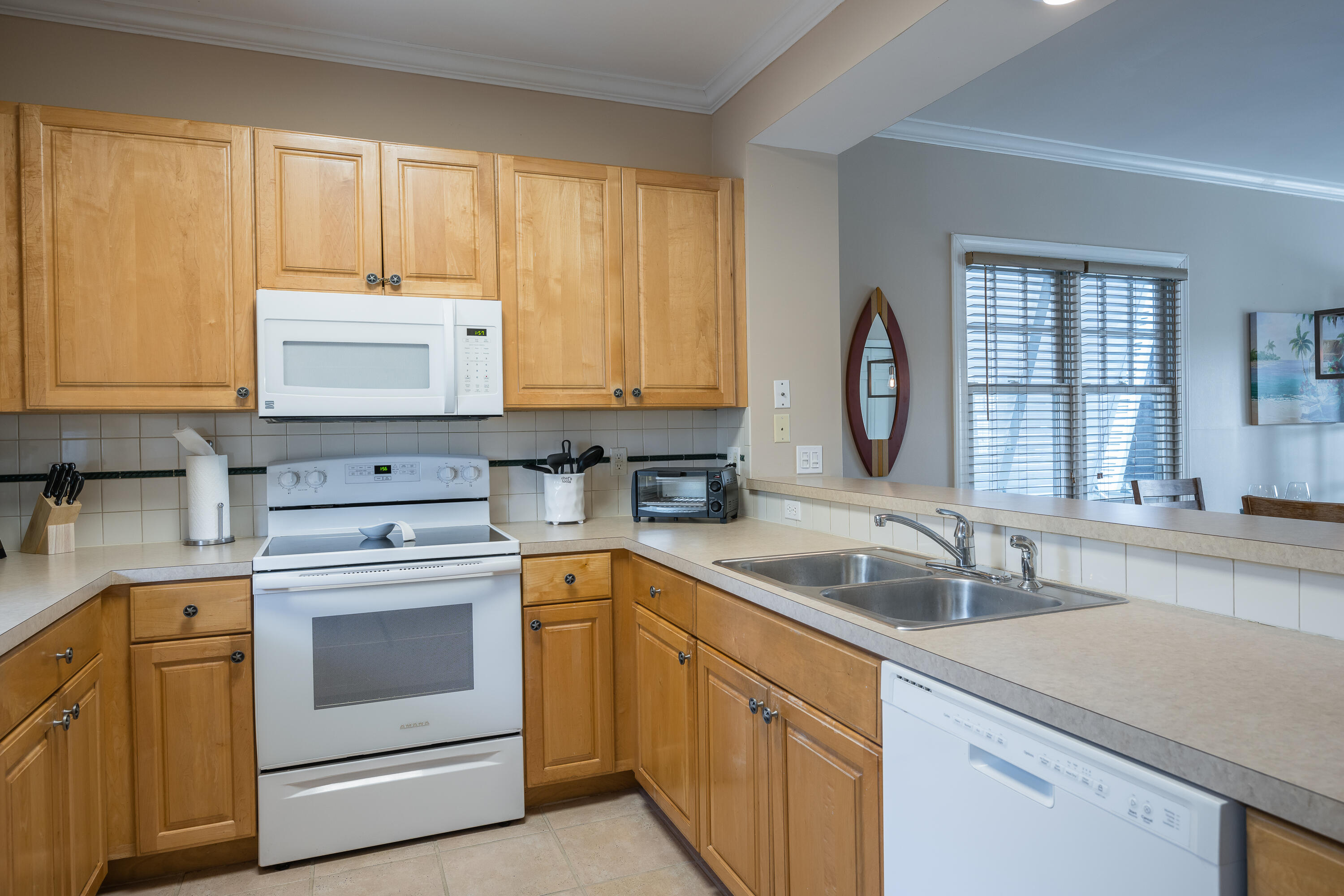 243 Golf Club Drive Key West, FL 33040 - Photo 4 of 54 a kitchen with a sink stove and cabinets