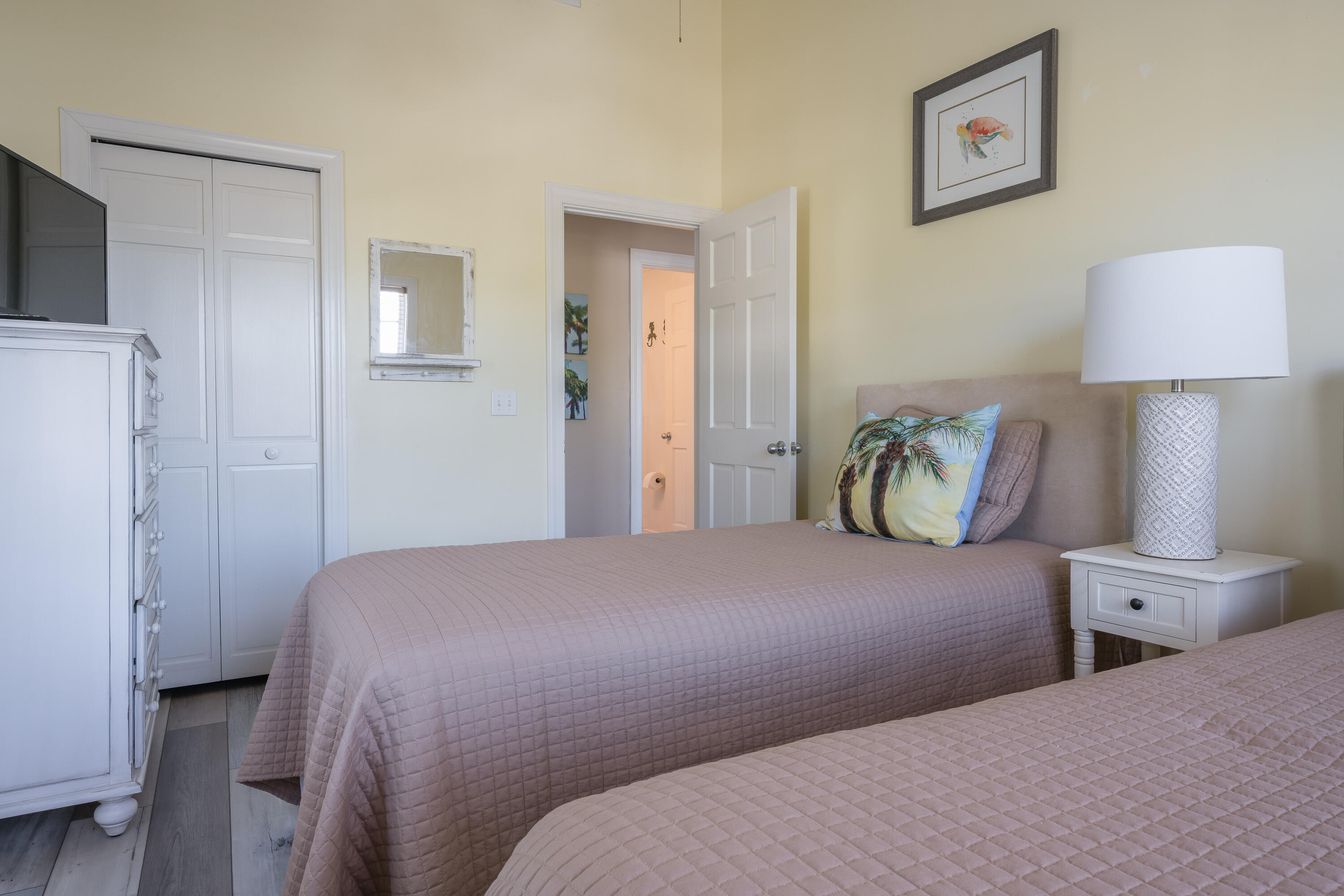 243 Golf Club Drive Key West, FL 33040 - Photo 42 of 54 a bedroom with a bed and a lamp