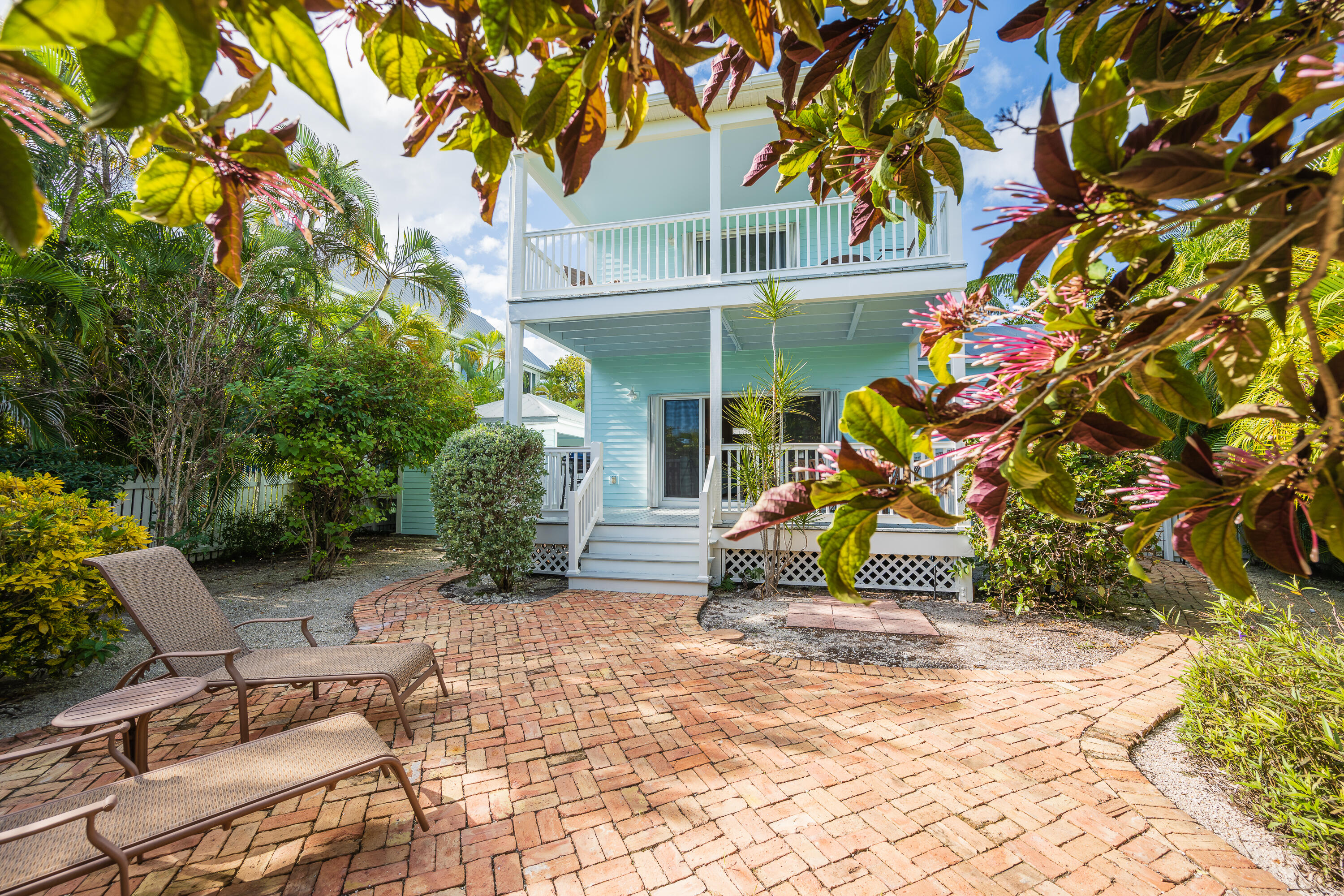 243 Golf Club Drive Key West, FL 33040 - Photo 48 of 54 a view of a patio with table and chairs and potted plants