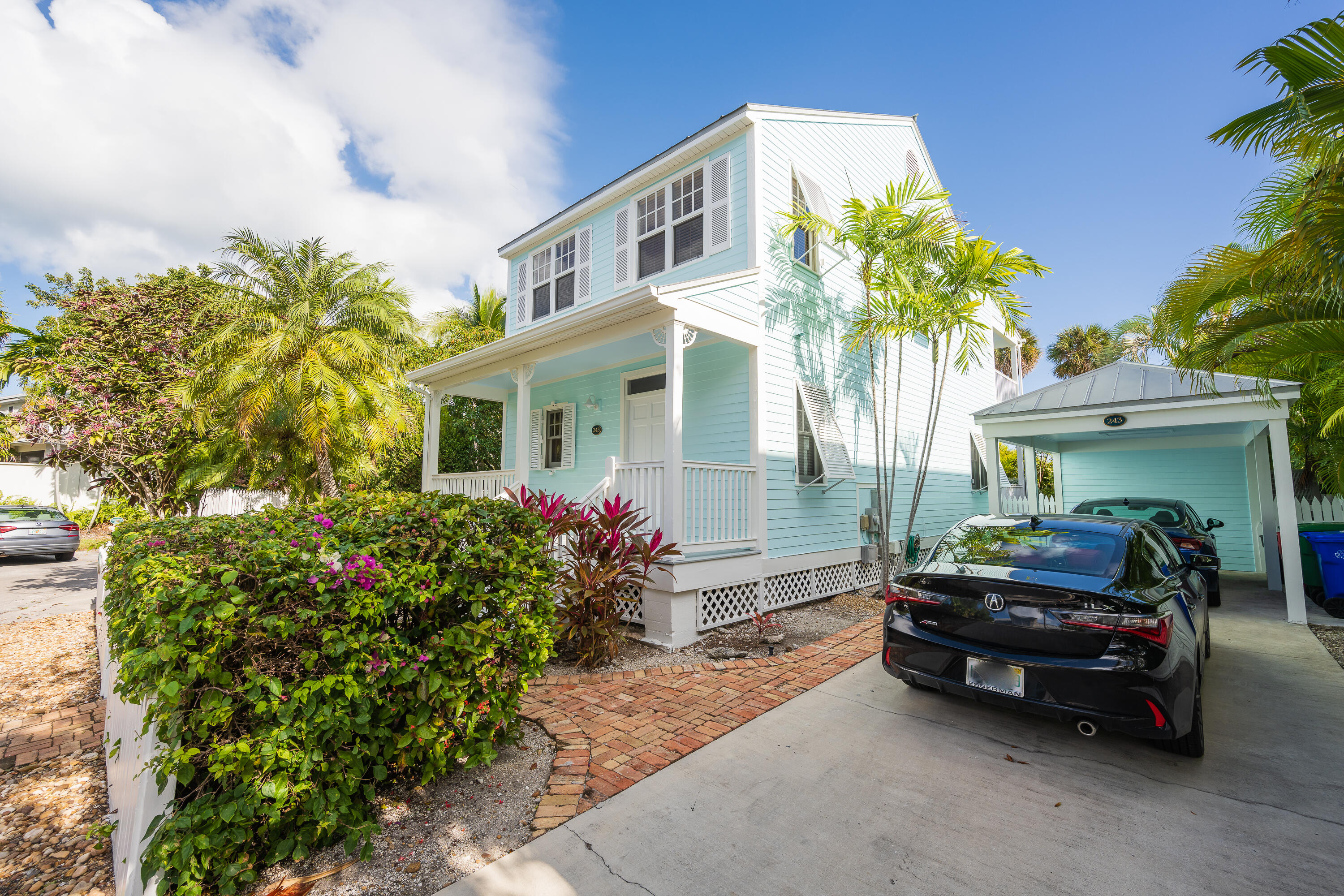 243 Golf Club Drive Key West, FL 33040 - Photo 49 of 54 a car parked in front of a house