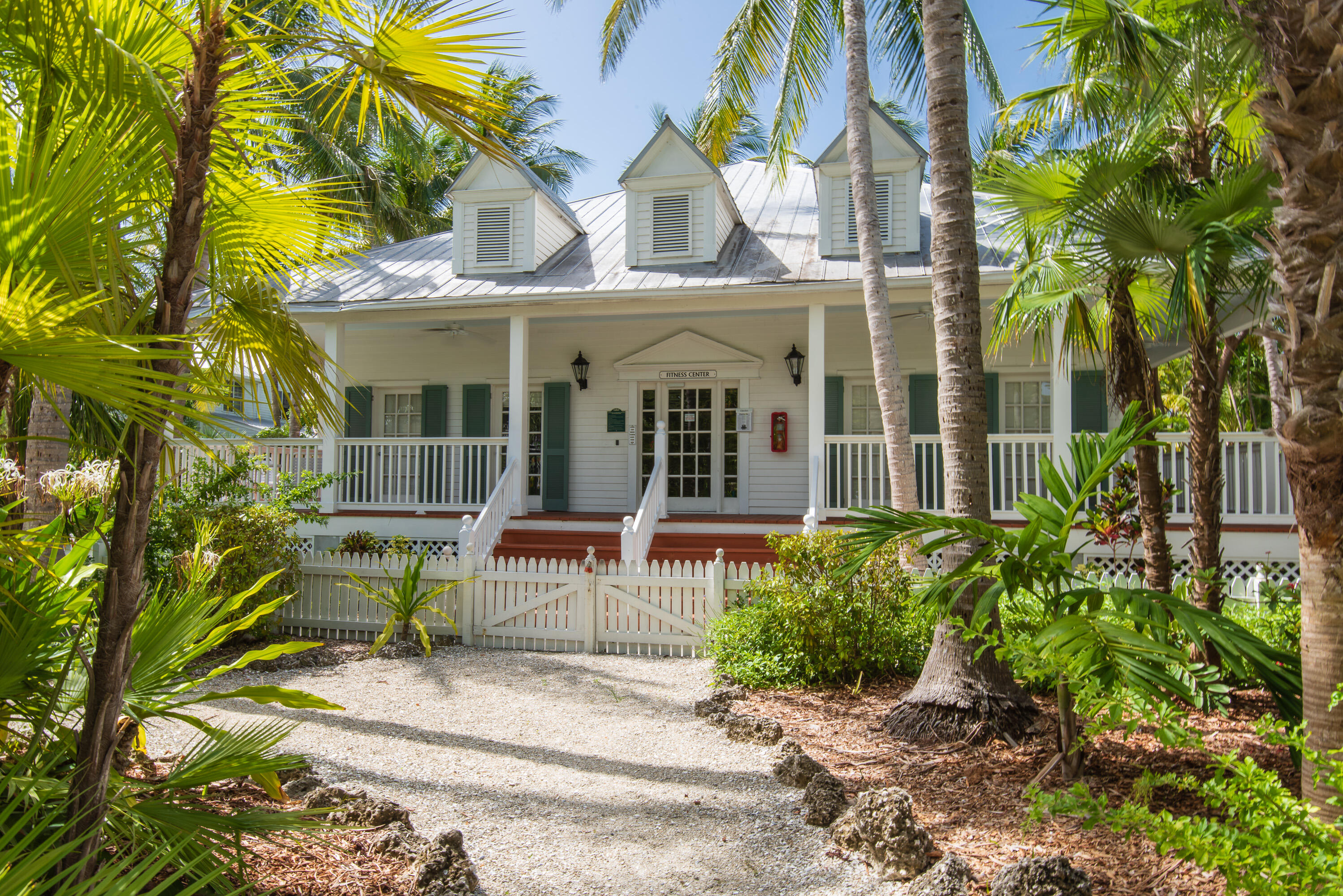 243 Golf Club Drive Key West, FL 33040 - Photo 50 of 54 front view of a house with a garden and plants