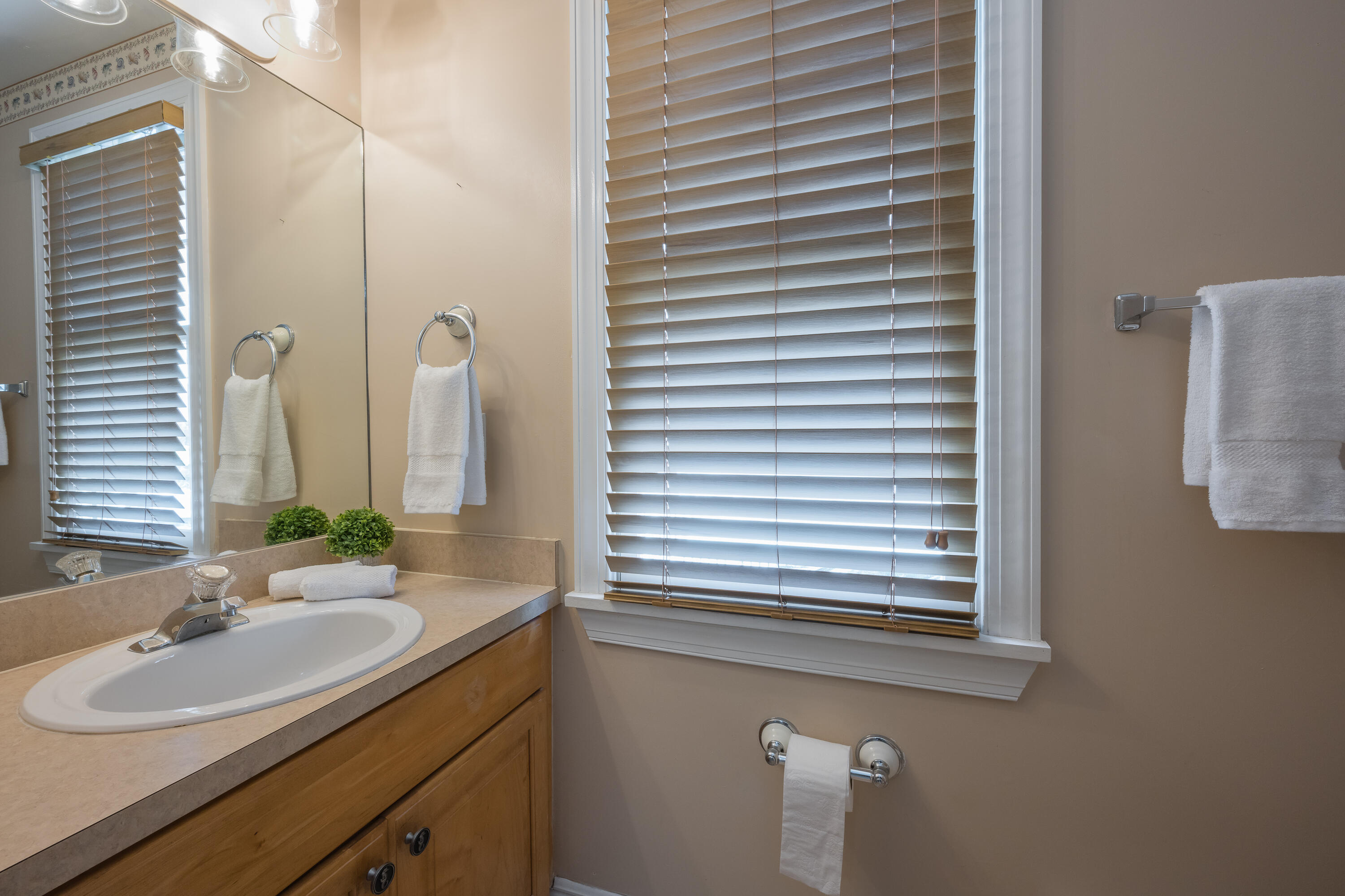 243 Golf Club Drive Key West, FL 33040 - Photo 6 of 54 a bathroom with a sink and a mirror