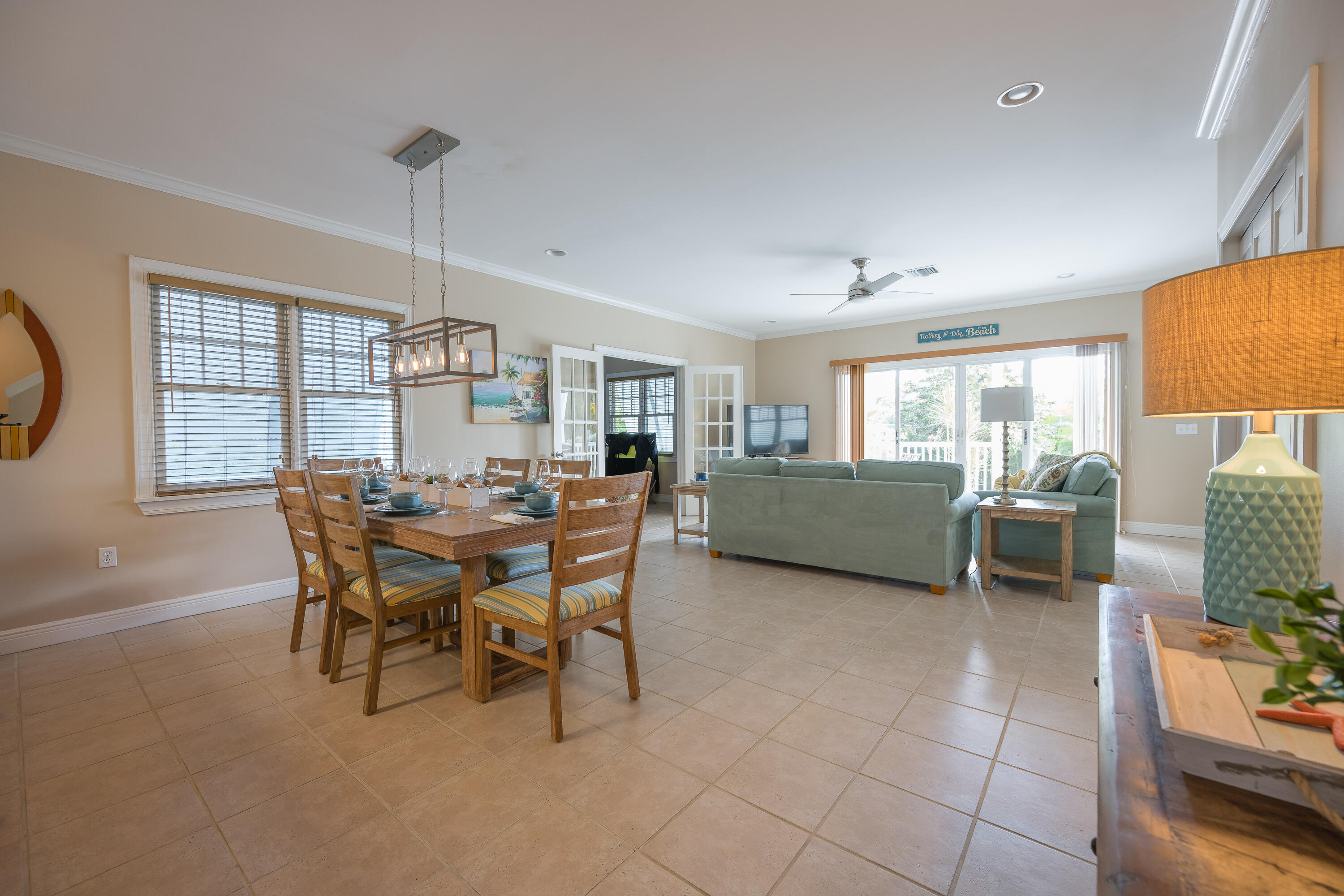 243 Golf Club Drive Key West, FL 33040 - Photo 7 of 54 a view of a dining room with furniture and a chandelier