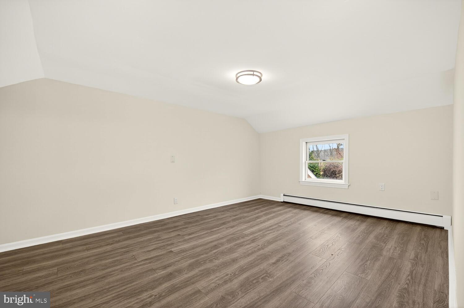 6746 Quaker Neck Road Chestertown, MD 21620 - Photo 49 of 50 an empty room with wooden floor and windows