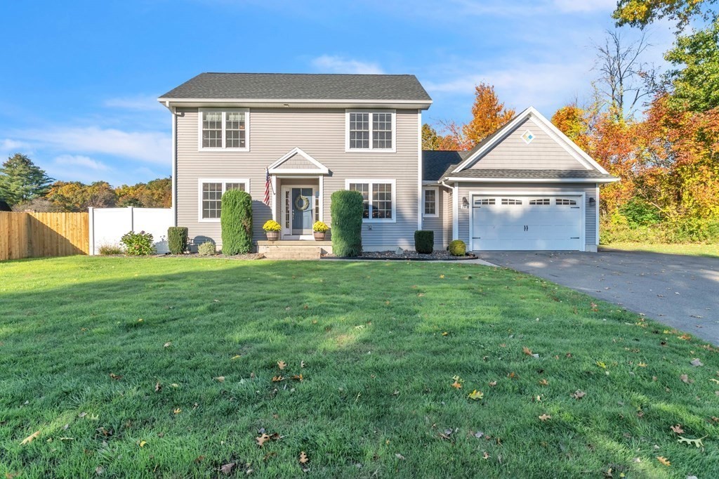 17 Irla Drive Ludlow, MA 01056 - Photo 1 of 36 a front view of a house with a yard and garage