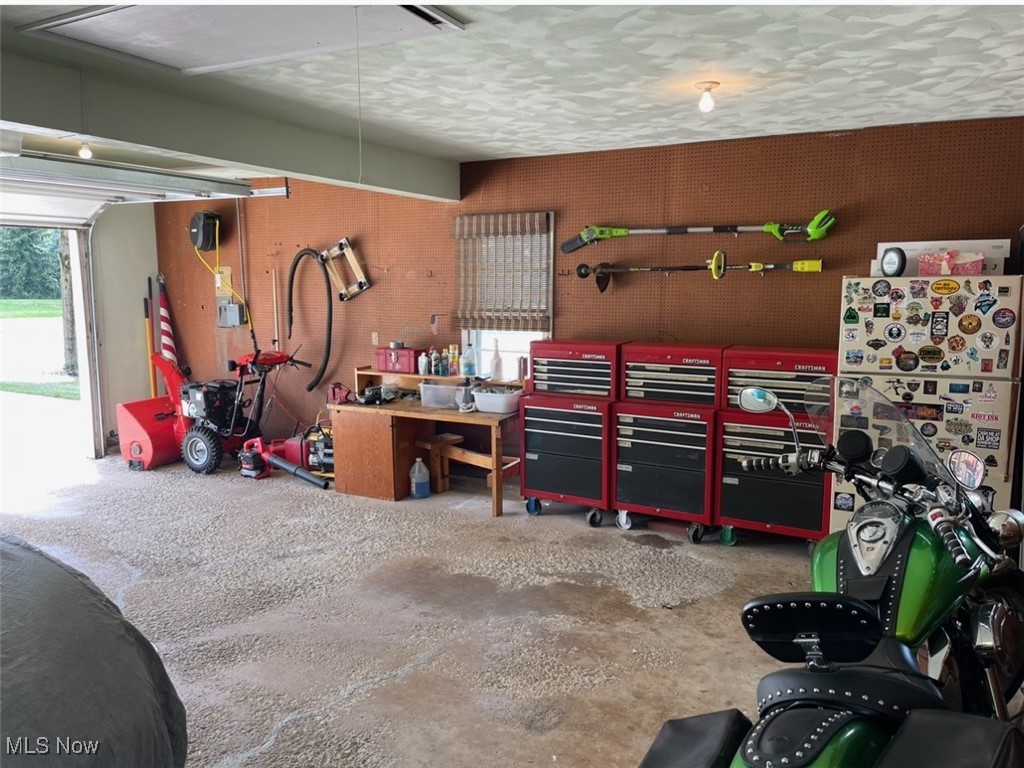 8121 Johnnycake Ridge Road Mentor, OH 44060 - Photo 34 of 39 Garage featuring a workshop area