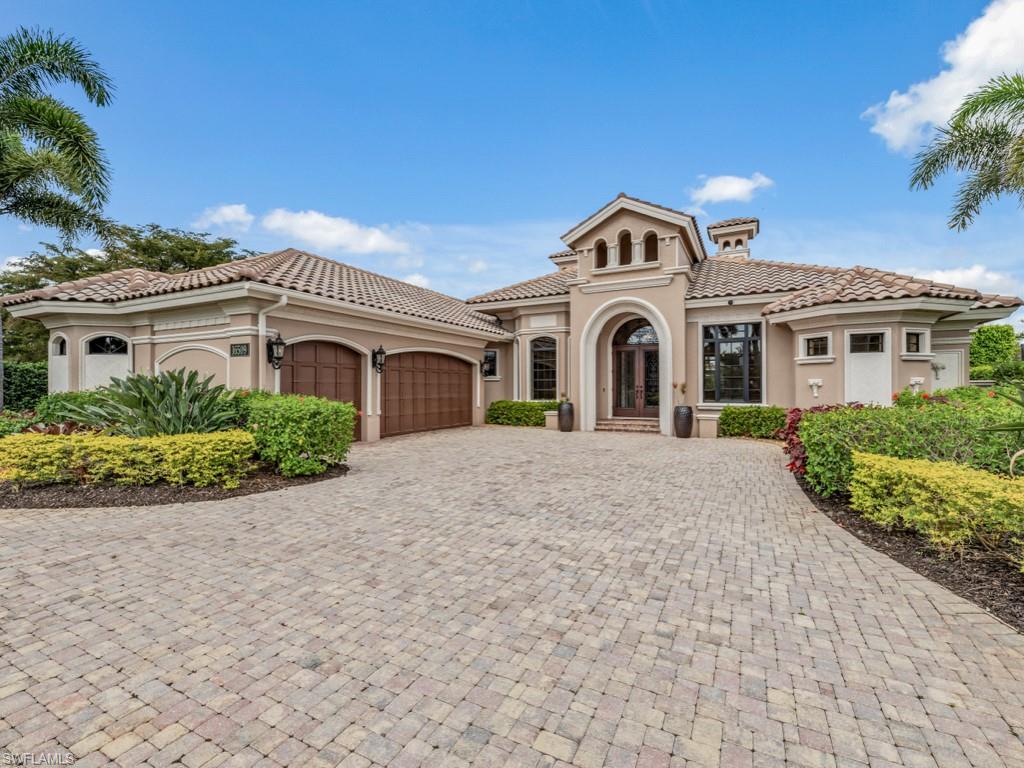 16509 Cellini Lane Naples, FL 34110 - Photo 21 of 49 a front view of a house with a garden