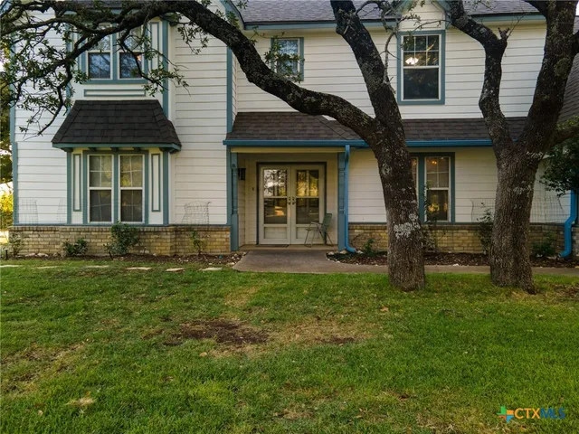 front view of a house with a yard