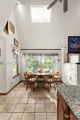 a room with lots of wooden furniture and a window