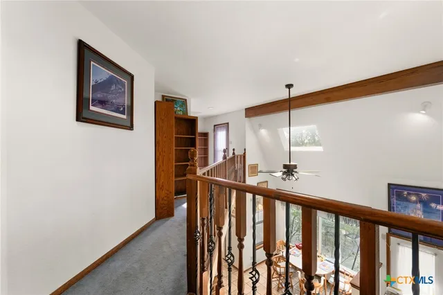 a view of staircase with window