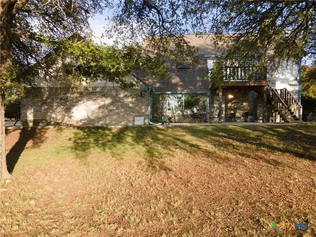 a view of building with trees in the background