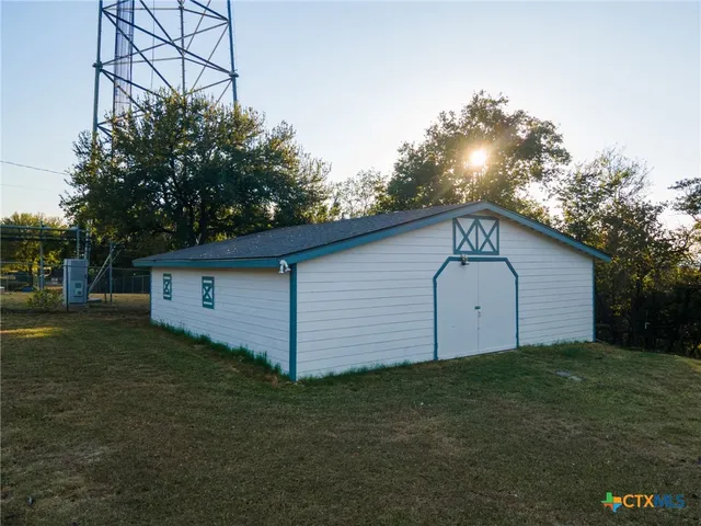 a view of a backyard of the house