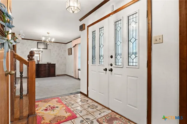 a view of an entryway with a rug