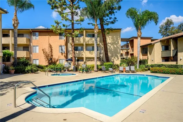 a view of swimming pool with outdoor seating