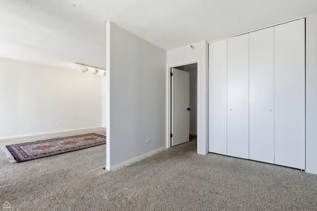 a bathroom with a sink vanity mirror and toilet