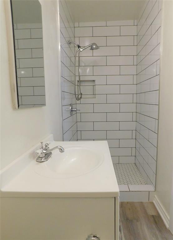 819 Thomas Street Denton, TX 76201 - Photo 19 of 33 a bathroom with a sink and a shower