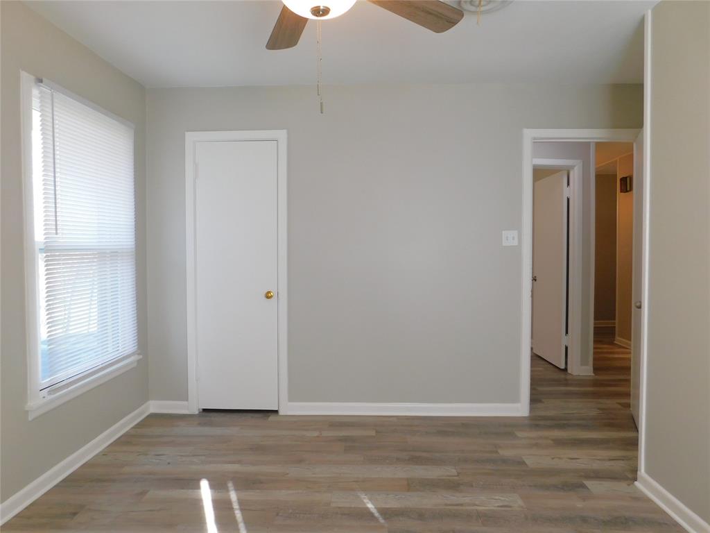 819 Thomas Street Denton, TX 76201 - Photo 20 of 33 a view of an empty room with window and wooden floor