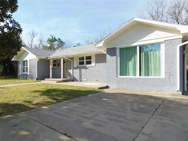 a swimming pool with outdoor seating