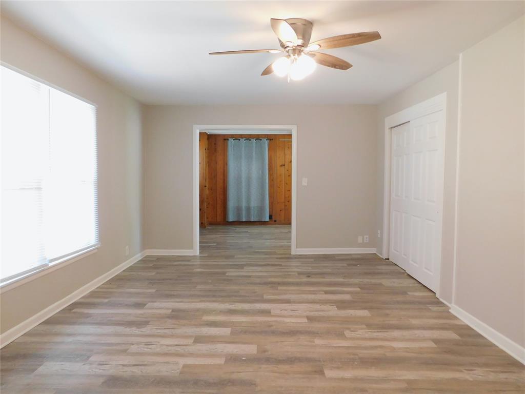 819 Thomas Street Denton, TX 76201 - Photo 10 of 33 a view of an empty room with a window