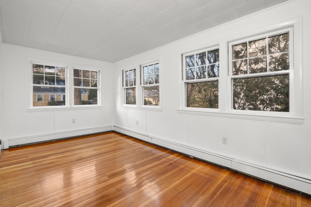 16 Intervale Road Wellesley, MA 02481 - Photo 11 of 24 a view of empty room with wooden floor and fan