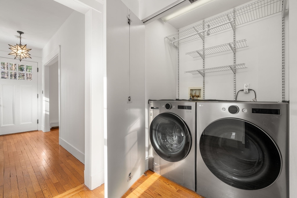 16 Intervale Road Wellesley, MA 02481 - Photo 12 of 24 a view of a hallway with washer and dryer