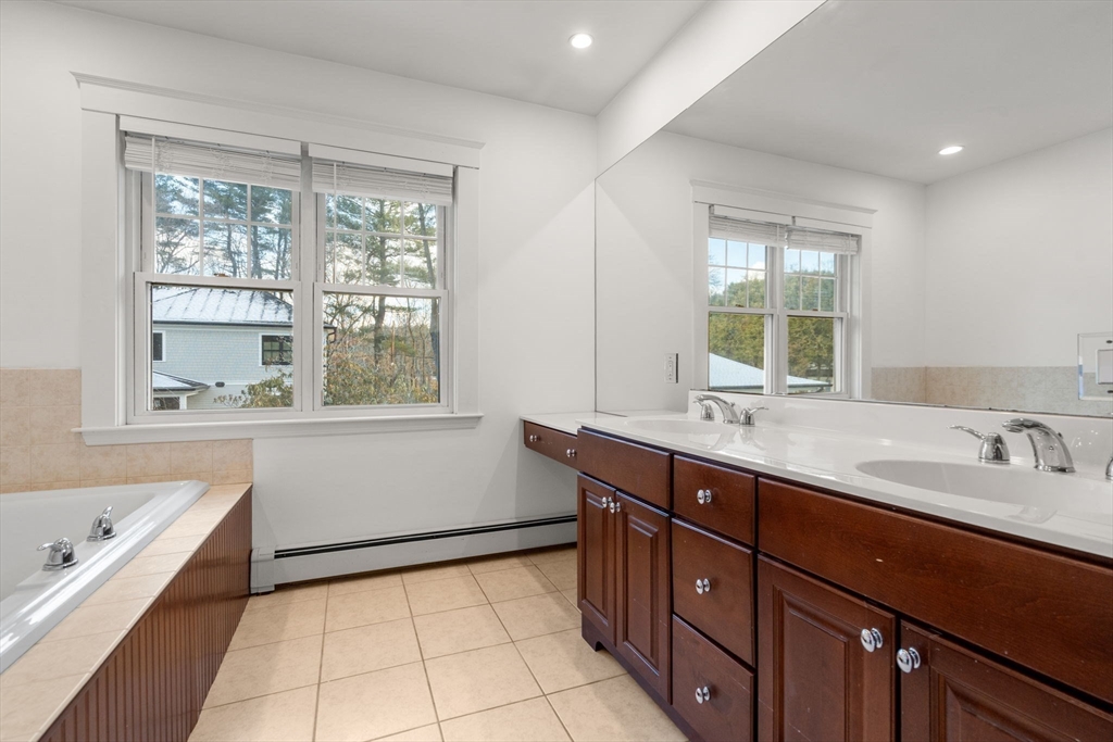 16 Intervale Road Wellesley, MA 02481 - Photo 16 of 24 a bathroom with a tub sink and mirror