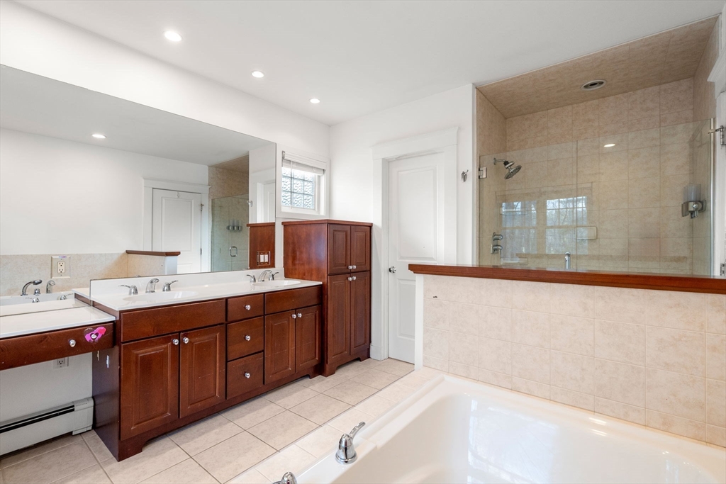 16 Intervale Road Wellesley, MA 02481 - Photo 17 of 24 a spacious bathroom with a tub sink and mirror